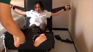 Extremely ticklish Chinese girl in stocks Porn - SpankBang