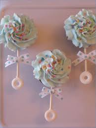 Baby Shower Cupcakes That Are Too Cute To Eat Baby Rattle Cupcakes Baby Shower Cupcakes Baby Shower Fun