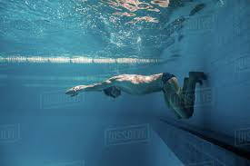 Underwater Picture Of Male Swimmer Swimming I Swimming Pool Stock Photo Dissolve