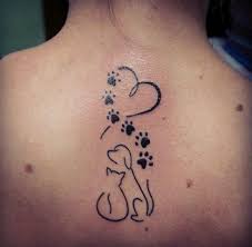 A dog tattoo paired with sun. 27 Best Cat Dog Tattoo Designs The Paws