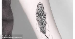 If you liked the handwriting idea, this next design is for you. Fine Line Feather Tattoo On The Left Inner Forearm