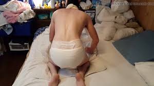 Diaper boy pees his thick diaper and masturbates