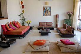 With gypsum ceiling, vitrified flooring, long snug l shaped sofa, a huge airy terrace , muted colours and quirky accents, the living room is an epitome of contemporary luxury, use of indian art and craft, the terrace with gorgeous view of endless greenery, is a perfect indulgence! Indian Minimalism The New Decor Norm The Yellow Sparrow