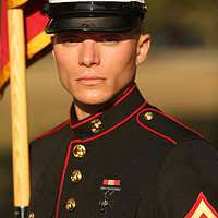 U.S. Marine Sgt. David Busenbark, center, a small arms