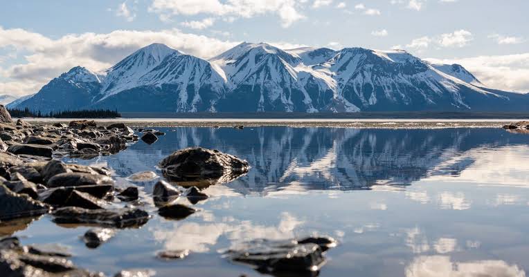 Atlin, British Columbia has a glacial lake surrounded mountains