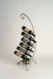 Curved Floor Standing Metal Wine Rack A wall wine rack can be a great way to store wine so that it ages properly and is displayed in a fashion that if you are short on floor, table or surface space the wine wall rack is a great solution.