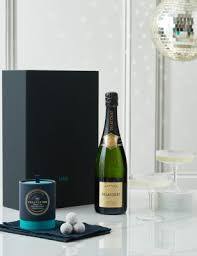 Champagne and navy ribbons compliment the beautiful champagne picks and christmas ornaments. Champagne Gifts M S