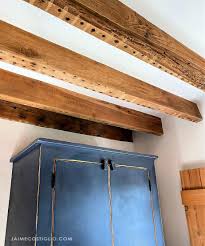 Sometimes other extensions are attached to the beamed ceiling for giving a beautiful look. Ceiling Makeover Exposed Wood Beams Jaime Costiglio