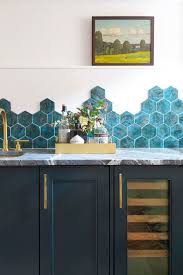 A glass tile backsplash in your kitchen or bathroom announces itself with shimmering light and rich colors. 55 Best Kitchen Backsplash Ideas Tile Designs For Kitchen Backsplashes