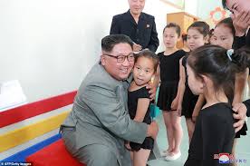 Teachers will be expected to teach the outlandish claim as fact, according to a new teacher's manual reported. Beaming Kim Jong Un Hugs Schoolchildren And Watches Them Play Table Tennis Daily Mail Online