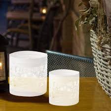 Metal ones give an industrial touch to the space, while glass pillar candle holders have a sleek and modern vibe. Mind Reader White Iron Votive Candle Holder Compartments Snowflake Pattern With Handles Lantern Set Of 2 Vot2 Wht The Home Depot