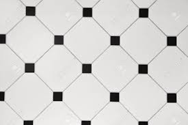 The tiles have a zig zag pattern. Ceramic White Octagon With Tessellation Black Tiles Background Stock Photo Picture And Royalty Free Image Image 135784879