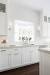 White Kitchen With Bronze Hardware