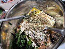 Grilled sardines in a frying pan on a black plate. Canned Tuna Sardines Fish Cake Healthy Keto Low Carb Zaneta Baran