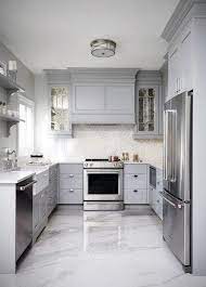 Gloss tiles look amazing but if you have pets or children you may wish to consider anti slip tiles. 23 White Kitchens Without Wood Floors Down Leah S Lane Kitchen Cabinet Design Kitchen Layout Best Flooring For Kitchen