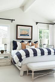 Modelo de dormitorio principal, marinero, grande, con paredes beige, suelo de madera en tonos medios, marco de chimenea de metal y chimenea tradicional — houzz. Absbf45 Amazing Beach Style Bedroom Furniture Today 2020 12 30
