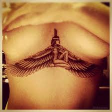 The geometrical background made of dots attenuates the whole image and shows the flight direction of the bird. Rihanna Isis Chest Tattoo Meaning Photos Under Breasts Tattoo