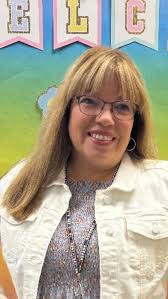 What hair color and style would be flattering for a 52-year-old overweight  woman with graying hair?