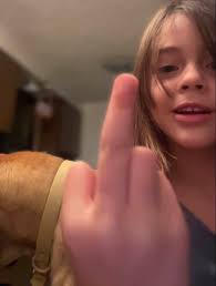 Spunky daughter photobombs family photos