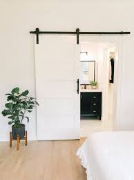 Gorgeous reclaimed fir barn doors for the posh master bathroom [design: White Bedroom Sliding Barn Door Master Bathroom Suite 102 Year Old Fixer Upper House Renovation Mid Scandinavian Home Design Fixer Upper House House Design