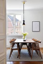 Rectangular dining room table with four straight legs to get a clean and subtle design. 10 Perfect Mid Century Modern Dining Chairs