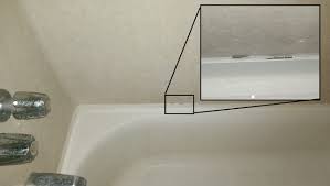 To remove your existing bathtub you'll first want to remove the tub surround or the tile around the bathtub. How To Fix Small Holes Separation In Caulk Around Bathtub Home Improvement Stack Exchange