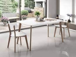 A solid wood table not only looks great, but will also stand the test of time.whether entertaining for guests or feeding the family, the white dining table in the dining room or on the patio is a gathering place. Claire Dining Tables White Top Dark Hardwood Frame On Sale