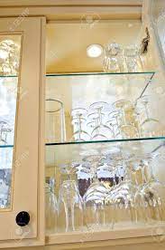 Custom glass shelves, floating glass shelves & cabinet glass. Kitchen Cabinet Close Up With Glass Shelves And Glasses Stock Photo Picture And Royalty Free Image Image 3930808