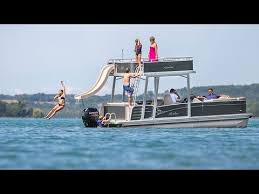 This boat has plenty of seating with an upper and lower deck and a slide on the boat for hours of fun on the water. 2017 Pontoon Boat Avalon Funship Boats With Water Slides Sundecks And More Youtube