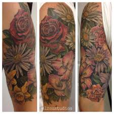 Beautiful Full Color Female Half Sleeve Tattoo Of Various Flowers Each Flower Represents A Different Family Member Half Sleeve Tattoo Sleeve Tattoos Tattoos