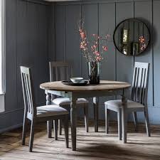 The most common round dining table material is cotton. Frank Hudson Gallery Cookham Grey Extending Round Dining Table
