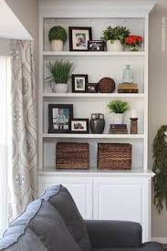 Styled Family Room Bookshelves How To Nest For Less Bookshelves In Living Room Living Room Shelves Shelf Decor Living Room Discover living room color ideas and smart living learn how to decorate bookshelves so they are both functional and pleasing to the eye. styled family room bookshelves how to