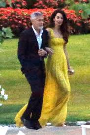 Amal clooney and george clooney were amongst the vip guest at prince harry and meghan markle's wedding earlier today. Amal Clooney Channeled Her Royal Wedding Look And Rocked Yellow Again