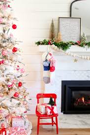 Decorating your fireplace for christmas offers warmth and creates a feeling of cosiness in any begin your mantel christmas decoration by hanging christmas cards on a green or red satin ribbon. My Modern Holiday Mantel With A Vintage Twist Modern Glam