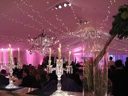 Chuppah with sheer white cloth draped over a wooden support decorated by colorful. Fairy Light Canopy Lighting Hire By Party Lights