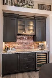 This system is constructed from manufactured wood and features a functional modern design that is an excellent choice for your home. Charming Brick Wall Sets The Tone In A Farmhouse Kitchen Home Bar Dura Supreme Cabinetry