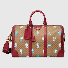 gucci doraemon x gucci medium duffle bag in 2021 bags gucci duffle bag