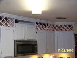 Do you have a too small space above your kitchen cabinets that you want to fill in? Pin By Kristin Bernard On Wine Rack Above Kitchen Cabinets Storage Above Kitchen Cabinets Above Cabinets