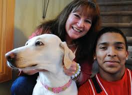 Boy saves woman in icy pond