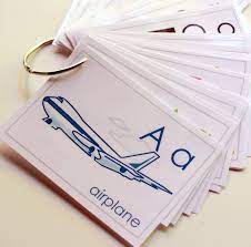 You might find it easiest to use a credit card to help push out air bubbles and round out the corners of the photo. Diy Laminated Alphabet Flashcards The Cottage Mama
