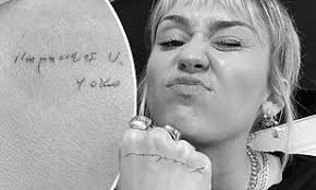 From her very first tattoo 'just breath' to the most recent. Miley Cyrus Displays New Freedom Hand Tattoo Amid Ongoing Divorce And Ink Showing Yoko Ono Note Daily Mail Online