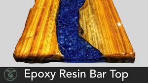 I agree epoxy countertops can be beautiful but i suspect your product is more than minimal thickness clear coat the op seemed to be looking to find. Epoxy Resin Bar Top Using Reclaimed Wood Fire Glass Youtube