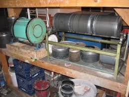 Constructed from wood, drill rod, rubber tubing, pvc pipe, plumber's end cap, pulleys, bearings, and hardware. Rock Tumbler Homemade Rock Tumbler Powered By A 1 6 Hp Motor Constructed From Steel Wood Pillow Block Rock Tumbler Homemade Rock Tumbler Rock Tumbler Diy