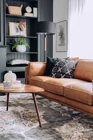 Make yours the centrepiece of the room by adding scatter cushions in orange or green, or go for a more modern, stark contrast by adding accessories in pale blues and pinks. Tan Leather Sofa