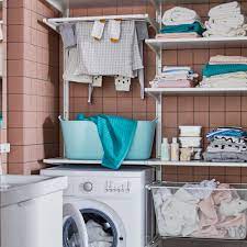 Two utility storage cabinets open to reveal five shelves, three of which are adjustable, allowing you to customize your storage for both big and small items. Utility Room Shelving Ideas Organise Laundry Supplies With Smart Solutions