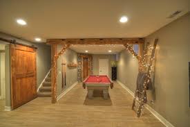 A rustic design can provide a comfortable, warm atmosphere for your basement remodeling project. Contemporary Rustic Finished Basement With Reclaimed Barn Beams Wine Room Rustic Basement Cleveland By Anthony Slabaugh Remodeling Design Houzz