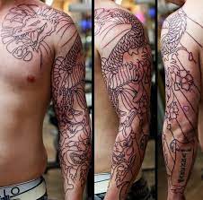 This extends from the top of the shoulder to the elbow. Black Outline Asian Dragon Tattoo On Man Left Full Sleeve