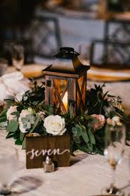 20 Greenery Filled Winter Wedding Ideas To Inspire Elegantweddinginvites Com Blog Lantern Centerpiece Wedding Winter Wedding Centerpieces Vintage Wedding Centerpieces