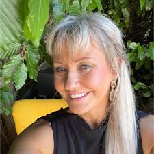 I find it hard to not warm to Davies, whose sunny disposition and  no-nonsense femininity defy a lot of ideas about what a successful business  person ought to look like"