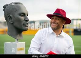 Canadian Football Hall of Fame inductee Chip Cox smiles after seeing his  bust for the first time, during a VIP reception prior to the induction  ceremony, Friday, Sept. 16, 2022, in Hamilton, Ontario. (Peter Power/The  Canadian Press via AP Stock Photo